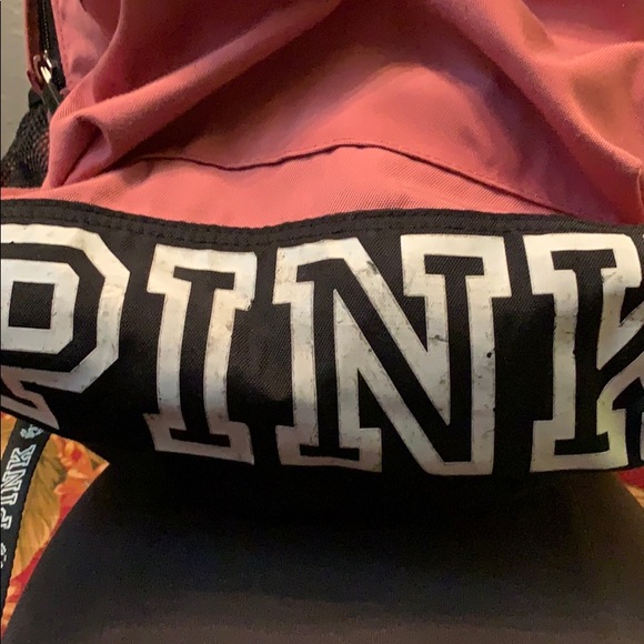 Pink back pack with large logo on bottom. - Picture 2 of 8